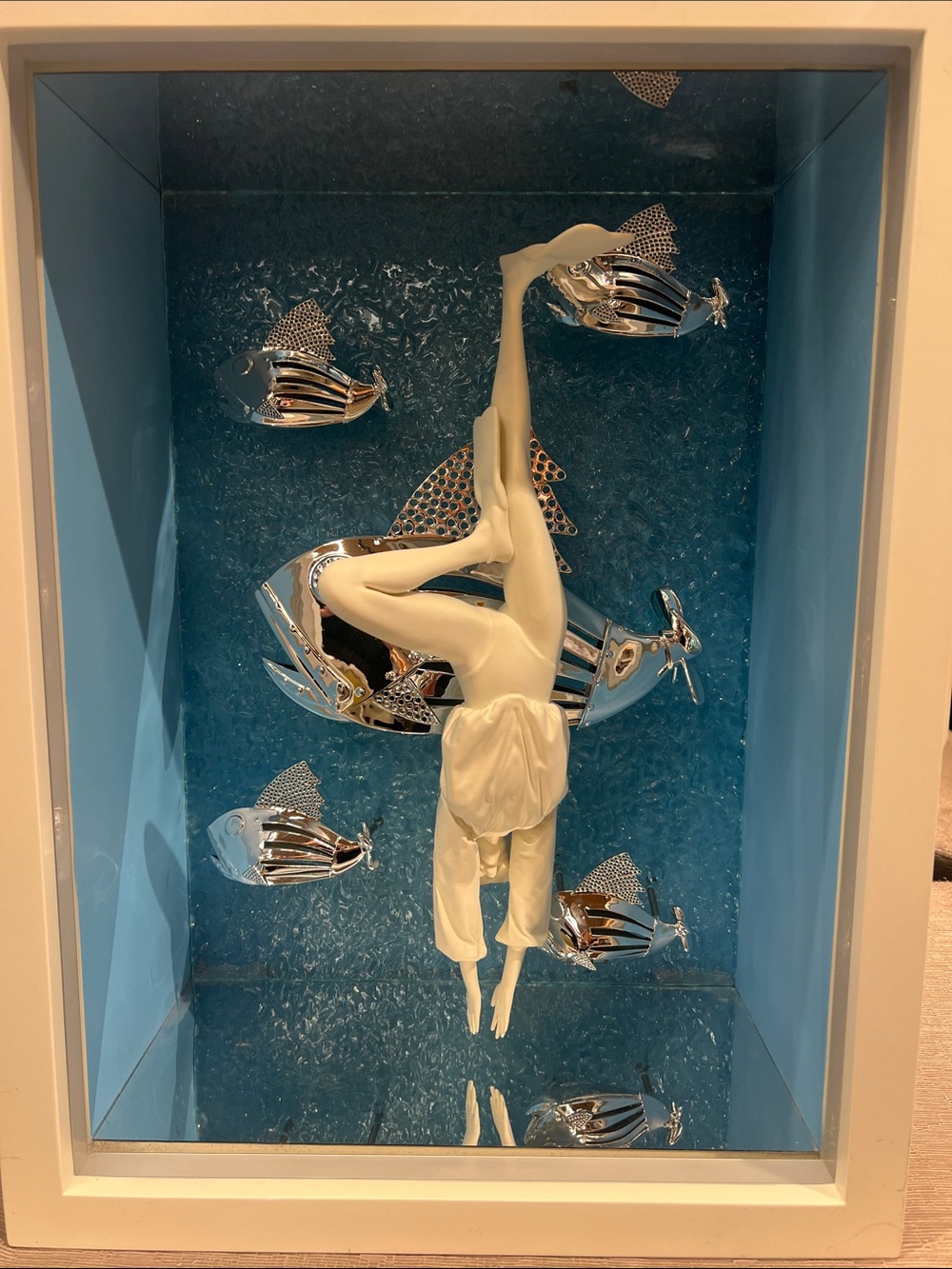 White Ceramic Diver Wall Art with Silver Fish on Blue Backdrop